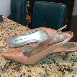 Pale pink, patent leather, mid sized heel